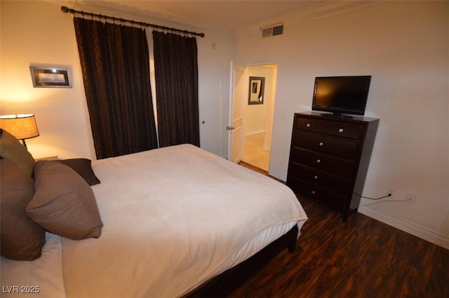 230 E Flamingo Rd Unit 129, Las Vegas, NV 89169 - bedroom with wood finished floors, ornamental molding, and baseboards