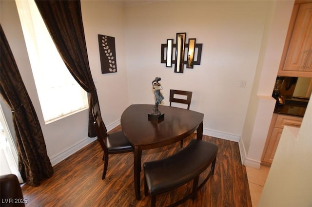 230 E Flamingo Rd Unit 129, Las Vegas, NV 89169 - dining room with baseboards and wood finished floors