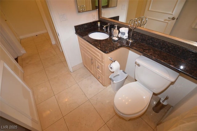 230 E Flamingo Rd Unit 129, Las Vegas, NV 89169 - bathroom featuring tile patterned floors, vanity, toilet, and baseboards