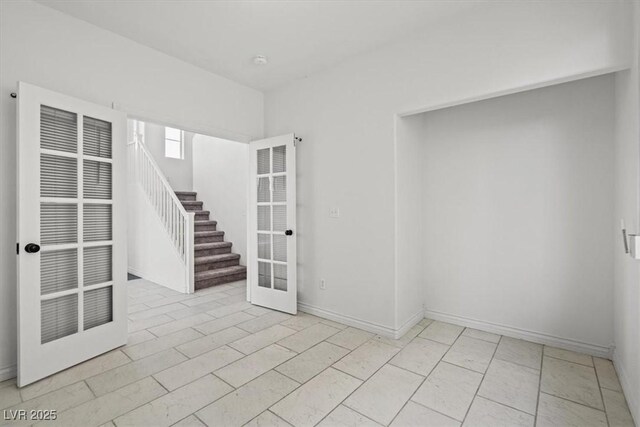10642 Dawns Mist Ave, Las Vegas, NV 89129 - spare room with stairs, a heating unit, baseboards, and a smoke detector