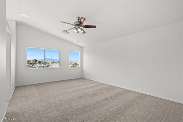 10642 Dawns Mist Ave, Las Vegas, NV 89129 - spare room with ceiling fan, vaulted ceiling, light carpet, and baseboards