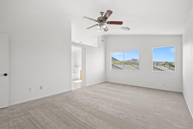 10642 Dawns Mist Ave, Las Vegas, NV 89129 - unfurnished room with lofted ceiling, light carpet, a ceiling fan, and baseboards