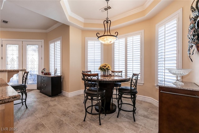 7718 Willow Cove Cir, Las Vegas, NV 89129 - dining room with ornamental molding, baseboards, and a tray ceiling