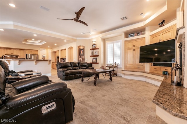 7718 Willow Cove Cir, Las Vegas, NV 89129 - living room with ornamental molding, a ceiling fan, recessed lighting, baseboards, and arched walkways