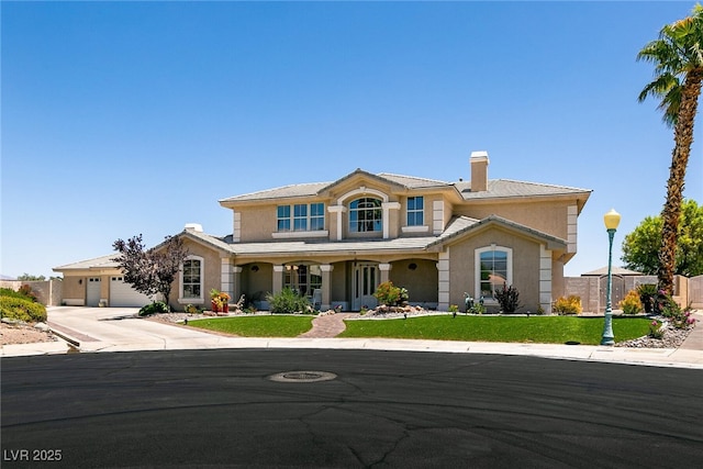 7718 Willow Cove Cir, Las Vegas, NV 89129 - mediterranean / spanish home featuring stucco siding, concrete driveway, a garage, a chimney, and a porch