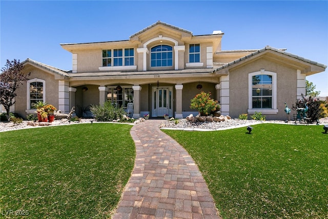 7718 Willow Cove Cir, Las Vegas, NV 89129 - view of front of property featuring stucco siding, a front lawn, and covered porch