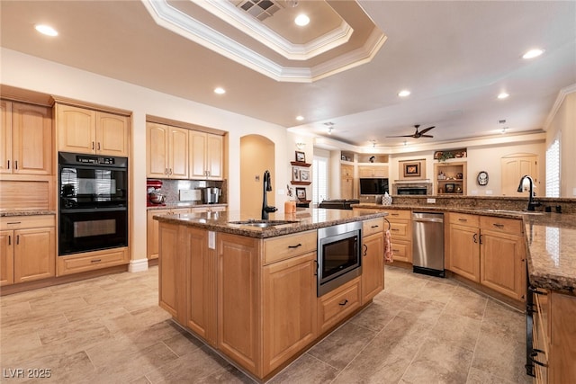 7718 Willow Cove Cir, Las Vegas, NV 89129 - kitchen featuring appliances with stainless steel finishes, a sink, crown molding, arched walkways, and a raised ceiling