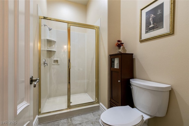 7718 Willow Cove Cir, Las Vegas, NV 89129 - bathroom with toilet, a shower stall, and baseboards