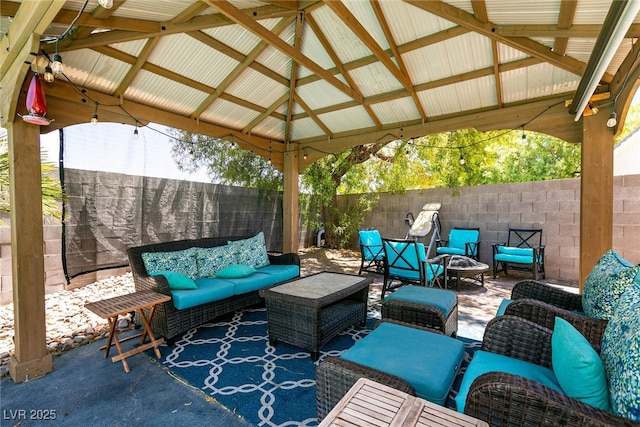 7718 Willow Cove Cir, Las Vegas, NV 89129 - fenced backyard with an outdoor hangout area, a gazebo, and a patio area