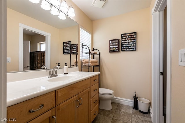 7718 Willow Cove Cir, Las Vegas, NV 89129 - bathroom with toilet, vanity, baseboards, and tile patterned floors