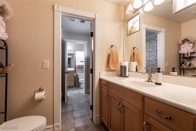 7718 Willow Cove Cir, Las Vegas, NV 89129 - full bath with toilet, vanity, and baseboards