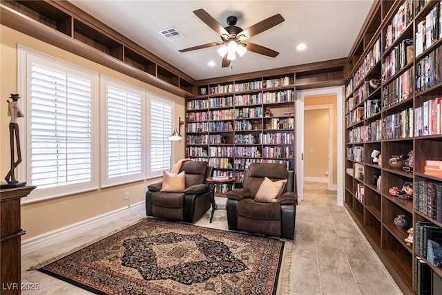 7718 Willow Cove Cir, Las Vegas, NV 89129 - living area with bookshelves, ceiling fan, baseboards, recessed lighting, and built in features