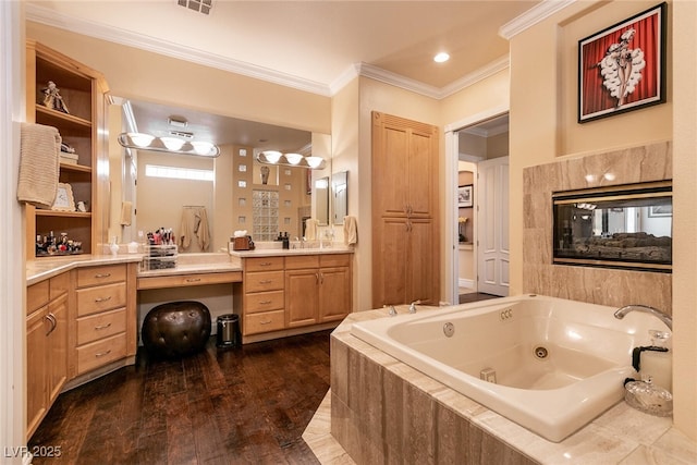 7718 Willow Cove Cir, Las Vegas, NV 89129 - full bathroom featuring crown molding, vanity, a tub with jets, and wood finished floors