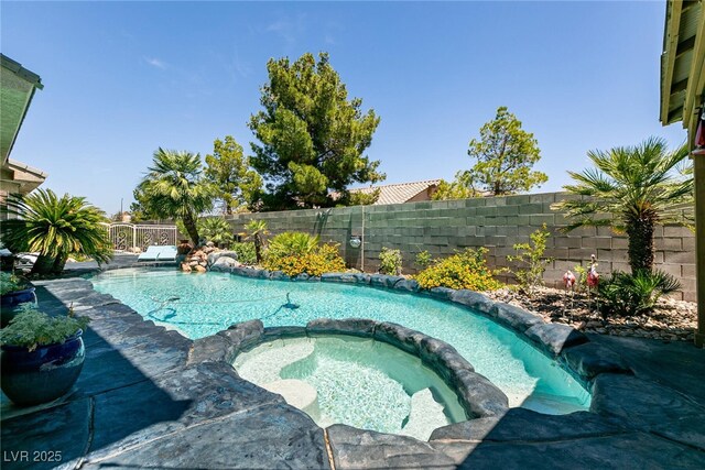 7718 Willow Cove Cir, Las Vegas, NV 89129 - view of pool featuring a fenced backyard and a pool with connected hot tub