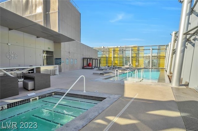 3722 Las Vegas Blvd Unit 603, Las Vegas, NV 89158 - community pool with a community hot tub and a patio