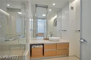 3722 Las Vegas Blvd Unit 603, Las Vegas, NV 89158 - full bath with a shower stall, vanity, tile patterned flooring, and recessed lighting