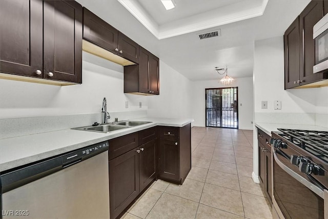 3935 Tirana Way, Las Vegas, NV 89103 - kitchen featuring stainless steel dishwasher, a sink, gas stove, light tile patterned floors, and light countertops