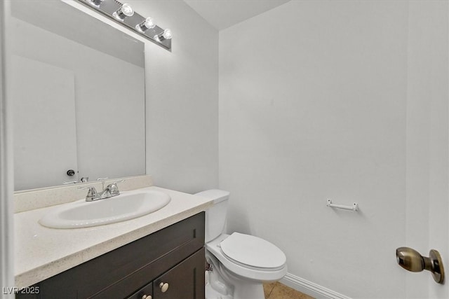 3935 Tirana Way, Las Vegas, NV 89103 - half bathroom with vanity, toilet, tile patterned floors, and baseboards