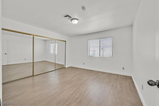 3935 Tirana Way, Las Vegas, NV 89103 - unfurnished bedroom featuring wood finished floors, baseboards, and a closet