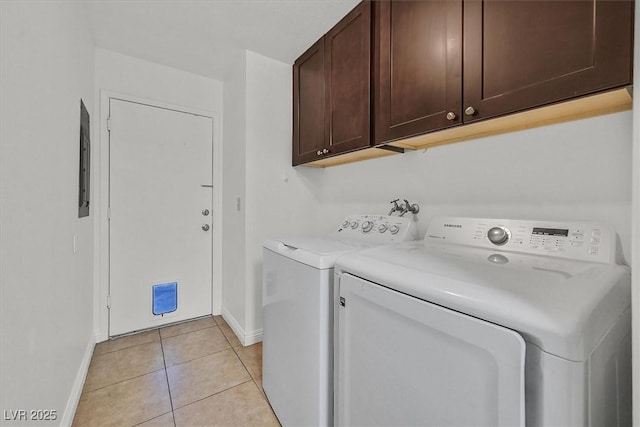 3935 Tirana Way, Las Vegas, NV 89103 - laundry area with cabinet space, baseboards, washer and dryer, and light tile patterned floors