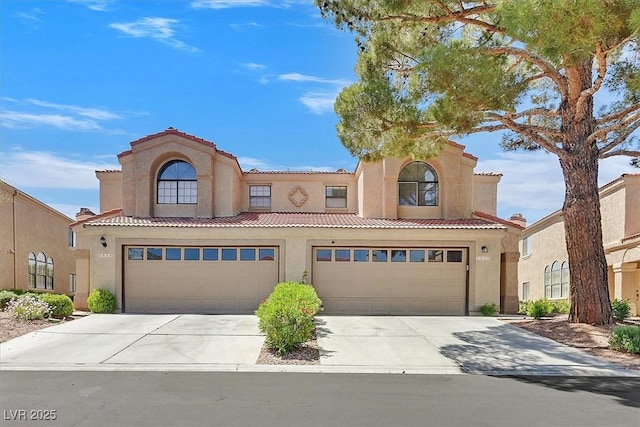 3935 Tirana Way, Las Vegas, NV 89103 - mediterranean / spanish-style house featuring stucco siding, a tiled roof, concrete driveway, and a garage