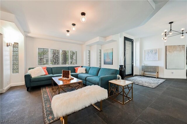 2231 S Tioga Way, Las Vegas, NV 89117 - living area with baseboards and a chandelier