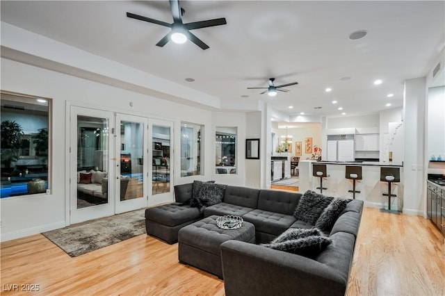 2231 S Tioga Way, Las Vegas, NV 89117 - living room with ceiling fan, light wood finished floors, baseboards, french doors, and recessed lighting
