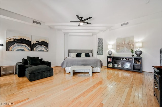 2231 S Tioga Way, Las Vegas, NV 89117 - bedroom featuring wood-type flooring, beam ceiling, and a ceiling fan