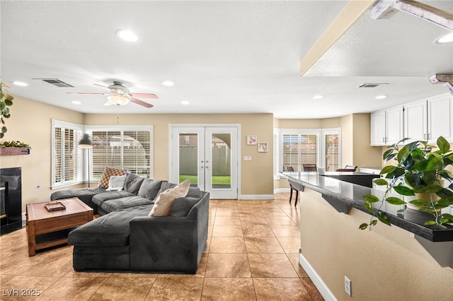 2021 Summit Pointe Dr, Las Vegas, NV 89117 - living room with french doors, a ceiling fan, baseboards, light tile patterned floors, and recessed lighting