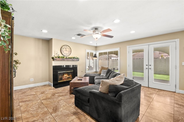 2021 Summit Pointe Dr, Las Vegas, NV 89117 - living area with french doors, a fireplace with flush hearth, a ceiling fan, baseboards, and recessed lighting