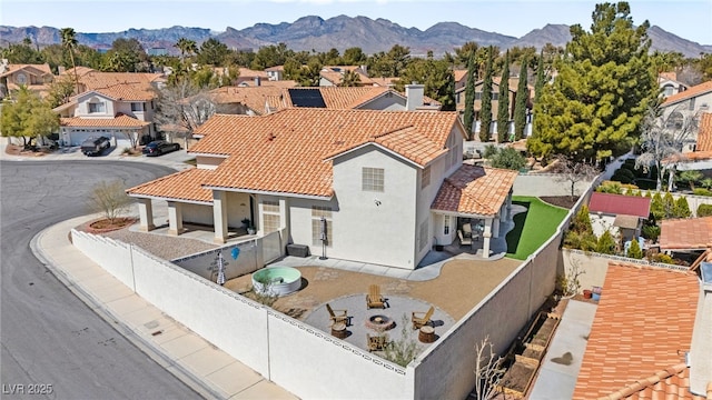 2021 Summit Pointe Dr, Las Vegas, NV 89117 - view of front of house featuring a tiled roof, a fenced backyard, and a residential view