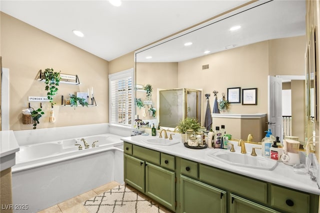 2021 Summit Pointe Dr, Las Vegas, NV 89117 - bathroom with double vanity, a bath, a stall shower, recessed lighting, and tile patterned floors