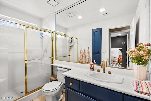 2021 Summit Pointe Dr, Las Vegas, NV 89117 - bathroom with toilet, vanity, a shower stall, and recessed lighting