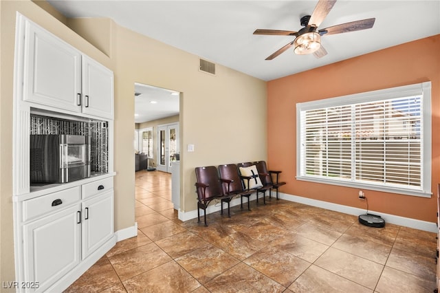 2021 Summit Pointe Dr, Las Vegas, NV 89117 - sitting room with a ceiling fan and baseboards