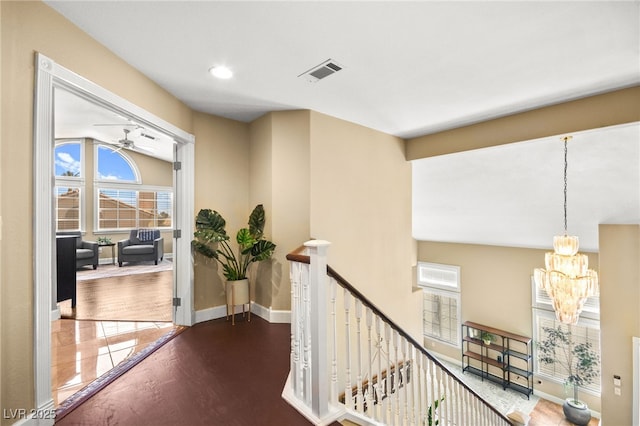 2021 Summit Pointe Dr, Las Vegas, NV 89117 - corridor with an upstairs landing, a chandelier, plenty of natural light, wood finished floors, and recessed lighting