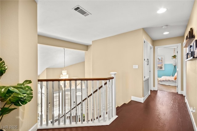 2021 Summit Pointe Dr, Las Vegas, NV 89117 - corridor with an upstairs landing, dark wood-type flooring, baseboards, a chandelier, and recessed lighting