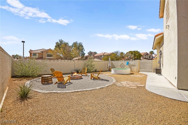 2021 Summit Pointe Dr, Las Vegas, NV 89117 - fenced backyard with an outdoor fire pit and a patio