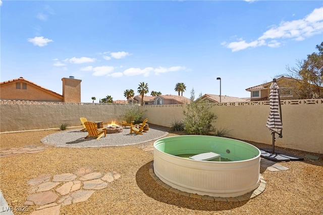 2021 Summit Pointe Dr, Las Vegas, NV 89117 - fenced backyard with a fire pit