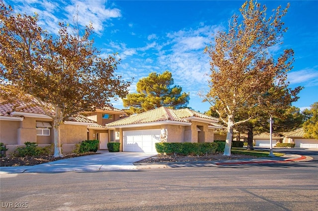 4911 Mount Pleasant Ln, Las Vegas, NV 89113 - mediterranean / spanish home with a tiled roof, an attached garage, stucco siding, and driveway