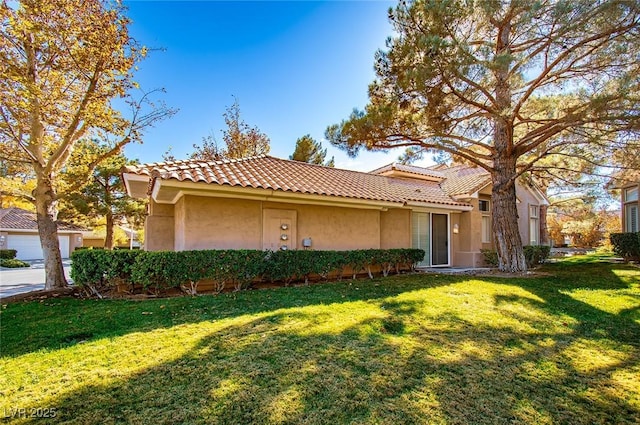 4911 Mount Pleasant Ln, Las Vegas, NV 89113 - mediterranean / spanish-style house with stucco siding, a front yard, and a tiled roof