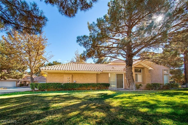 4911 Mount Pleasant Ln, Las Vegas, NV 89113 - view of front facade with stucco siding, a front lawn, and a tiled roof