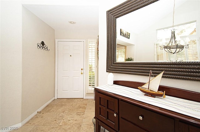 4911 Mount Pleasant Ln, Las Vegas, NV 89113 - corridor with a chandelier and baseboards