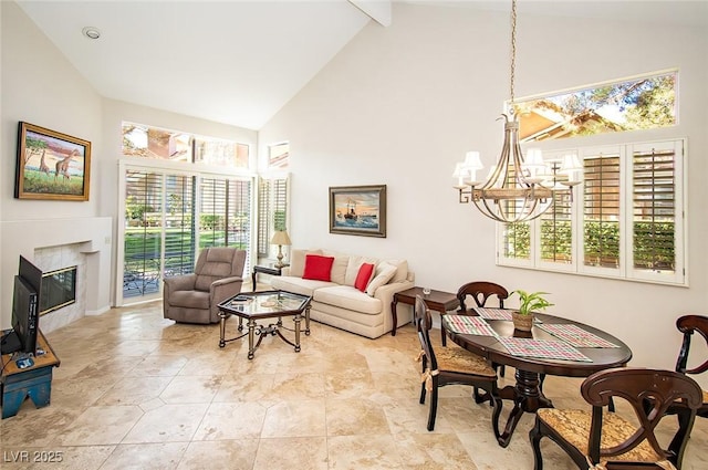 4911 Mount Pleasant Ln, Las Vegas, NV 89113 - living area featuring high vaulted ceiling, a chandelier, a glass covered fireplace, and beamed ceiling