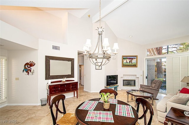 4911 Mount Pleasant Ln, Las Vegas, NV 89113 - dining area with a chandelier, high vaulted ceiling, baseboards, beamed ceiling, and a high end fireplace