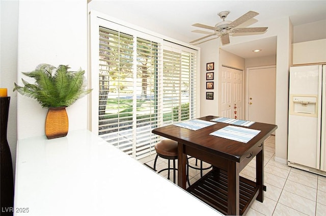 4911 Mount Pleasant Ln, Las Vegas, NV 89113 - dining space featuring light tile patterned floors and a ceiling fan