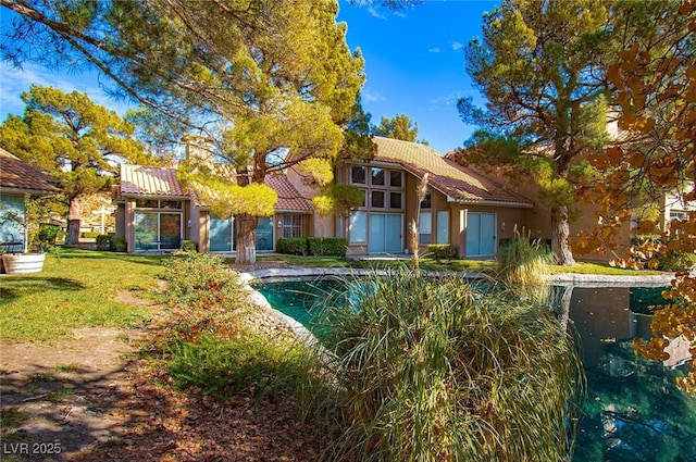 4911 Mount Pleasant Ln, Las Vegas, NV 89113 - outdoor pool with a lawn