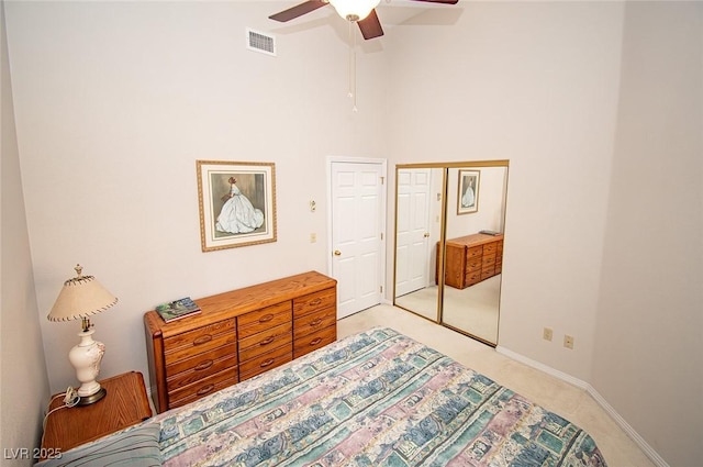 4911 Mount Pleasant Ln, Las Vegas, NV 89113 - bedroom featuring light carpet, a high ceiling, ceiling fan, and baseboards