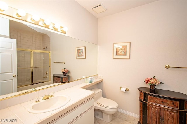 4911 Mount Pleasant Ln, Las Vegas, NV 89113 - bathroom with vanity, toilet, bath / shower combo with glass door, baseboards, and tile patterned flooring