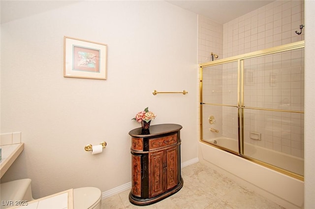 4911 Mount Pleasant Ln, Las Vegas, NV 89113 - full bath with toilet, bath / shower combo with glass door, baseboards, and tile patterned floors