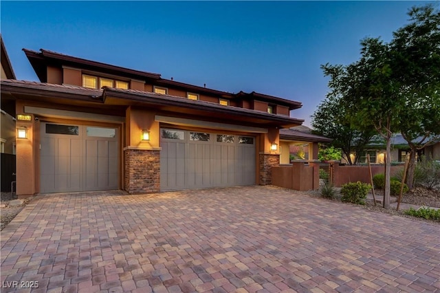 10433 Ember Rose Ave, Las Vegas, NV 89135 - prairie-style home featuring decorative driveway, a garage, brick siding, and stucco siding